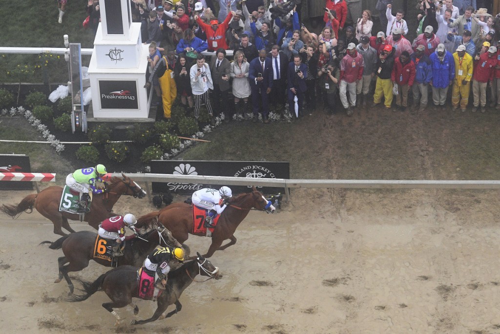 Justify, wearing No. 7 with Mike Smith aboard, appeared to be fading Saturday near the end of the Preakness. But Smith insists the horse had plenty in reserve and will be suited for a Triple Crown bid at a longer distance in the Belmont.