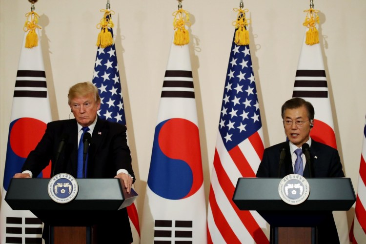 President Trump listens as South Korean President Moon Jae-in speaks during a news conference in Seoul in November. 