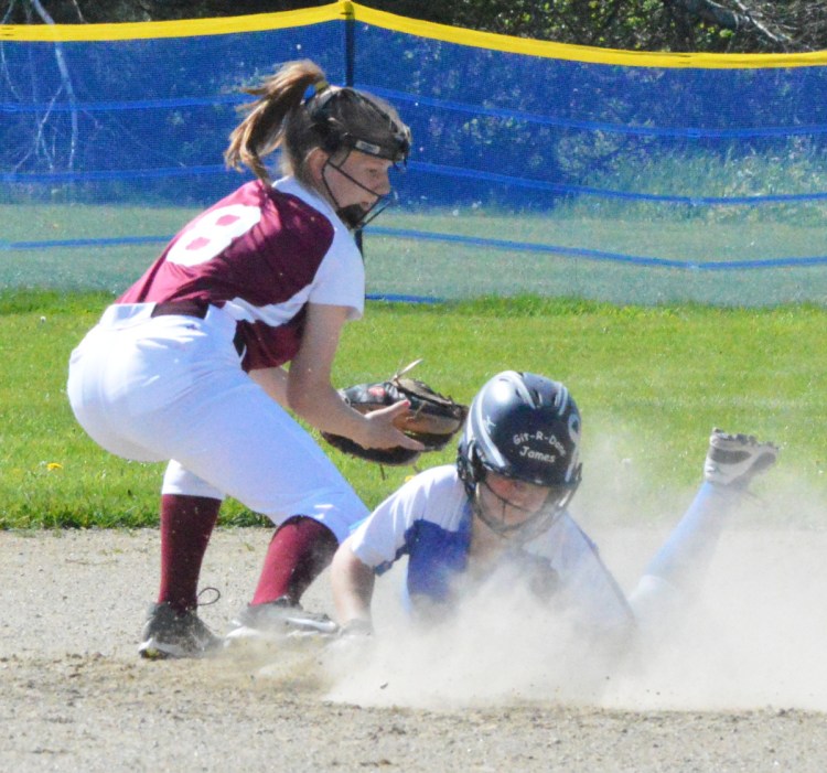 Sacopee Valley baserunner Lakyn Hink dives into second base ahead of a tag from Richmond shortstop Caitlin Kendrick, left, on Monday. Hink later scored the game's first run in Sacopee's 2-0 victory. (Brunswick Times Record photo by Bob Conn)