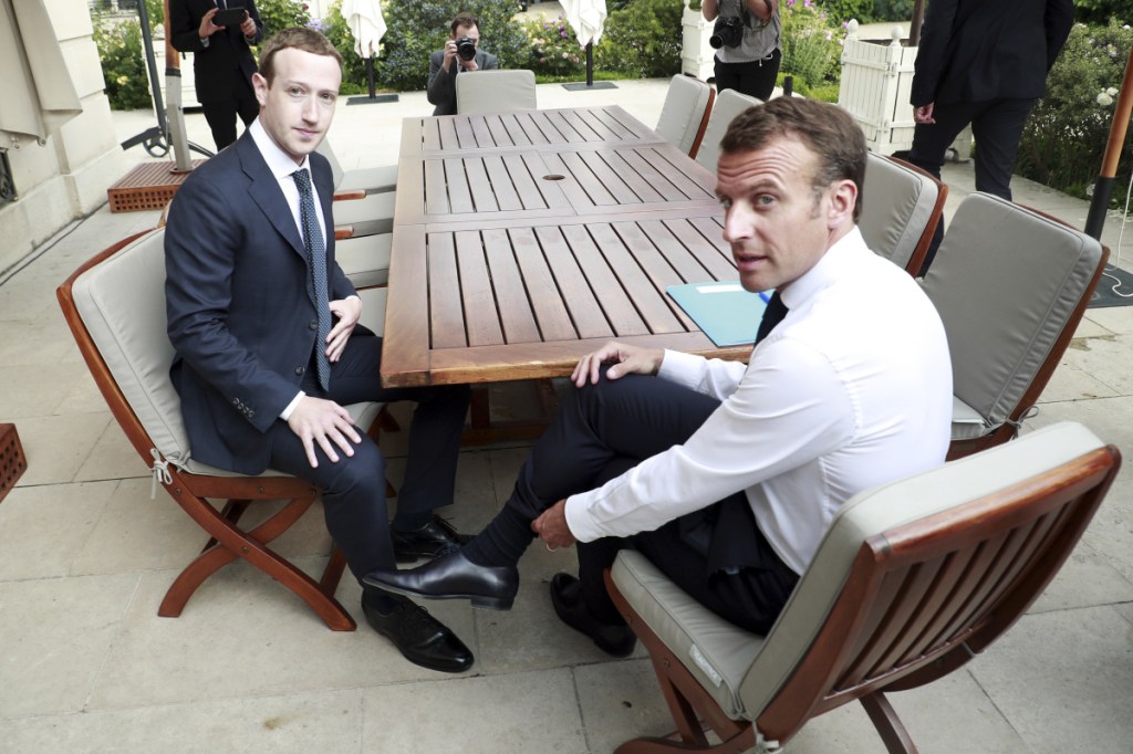 Facebook's CEO Mark Zuckerberg, left, meets with French President Emmanuel Macron at the Elysee Palace on Wednesday. European leaders have been much less tolerant of companies like Facebook when it comes to issues of data collection, use and privacy.