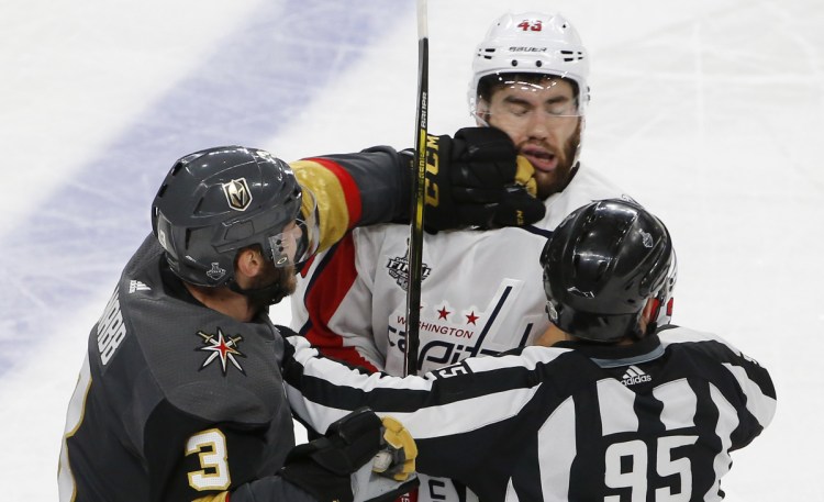 Golden Knights defenseman Brayden McNabb roughs up Tom Wilson of the Capitals in the third period Monday night in Game 1. Wilson had hit Jonathan Marchessault earlier with a high hit that was not penalized.