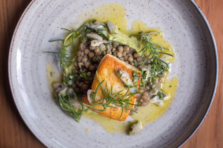 PORTLAND, ME - MAY 23: Halibut with lentils, razor clams, ramp mayo and agretti at Drifters Wife.  (Staff photo by Brianna Soukup/Staff Photographer)