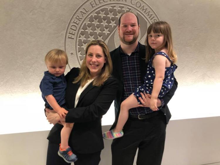 Liuba Grechen Shirley poses with her husband and two small children.