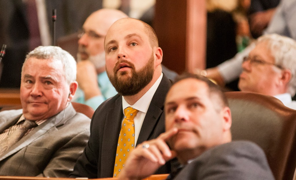 Rep. Matt Pouliot, R-Augusta, watches the vote tally board as his amendment for a one-day extension of the session goes down to defeat Wednesday.