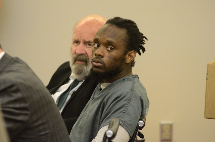 Murder defendant Aubrey Armstrong, right, listens in court Tuesday beside his translator, John Roy, as closing arguments were made at the Capital Judicial Center in Augusta. Armstrong has been using an interpreter to translate between English and Guyanese Creole.