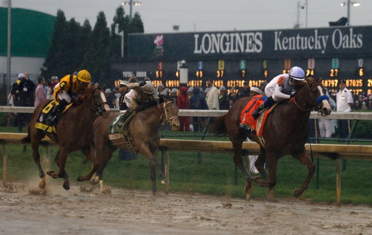 Mike Smith rides Justify to victory during the 144th running of the Kentucky Derby horse race at Churchill Downs Saturday in Louisville, Kentucky.