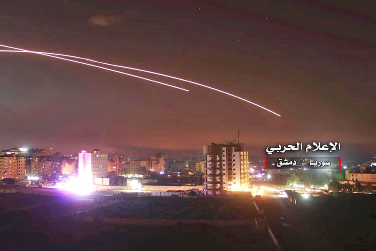 Israeli missiles target air defense positions and other military bases in Damascus, Syria, Thursday in response to an Iranian rocket barrage on Israeli positions in the Golan Heights.