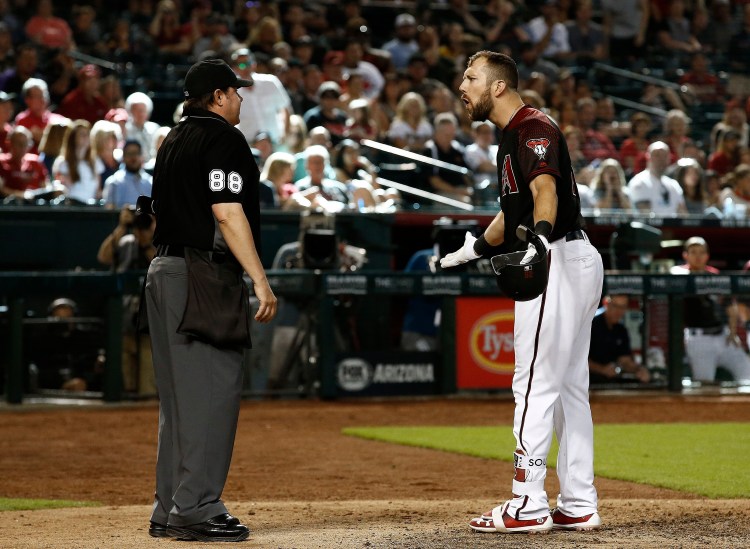 Arizona Diamondbacks' Steven Souza Jr., right, argues with umpire Doug Eddings after Souza was thrown out for throwing his bat after a third strike during the eighth inning of the team's baseball game against the Washington Nationals on Saturday in Phoenix. The Nationals won 2-1. 