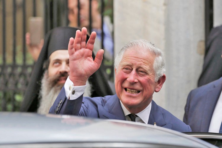 Britain's Prince Charles leaves a meeting with the head of Greece's Orthodox Church, Archbishop Ieronymos, in Athens, on May 10, 2018.  "Pleased to be able to welcome Ms. Markle to the Royal Family in this way."