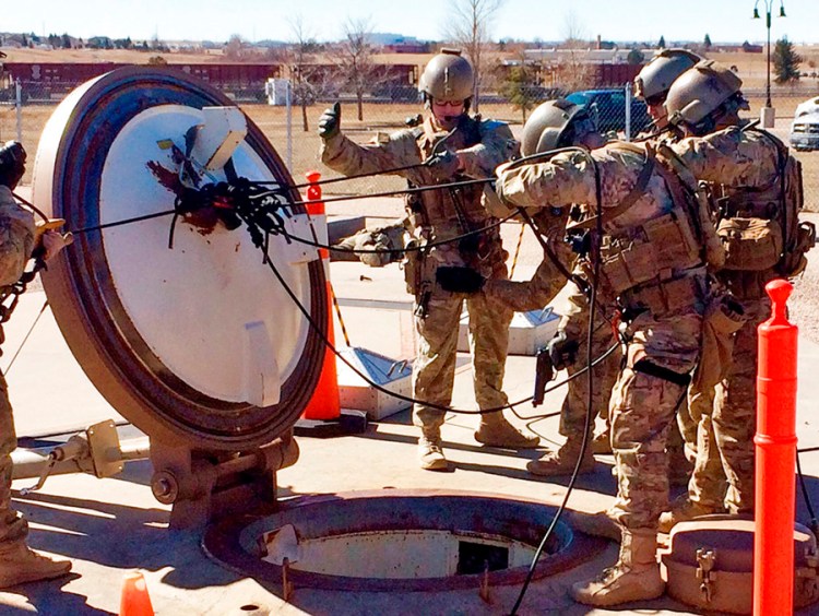 In this February 2016 photo, members of the 790th Missile Security Forces Squadron show their training for recapturing a Minuteman missile silo from an intruder. The demonstration took place just days before the Air Force announced the drug investigation, at the Francis E. Warren Air Force Base, near Cheyenne, Wyo. 