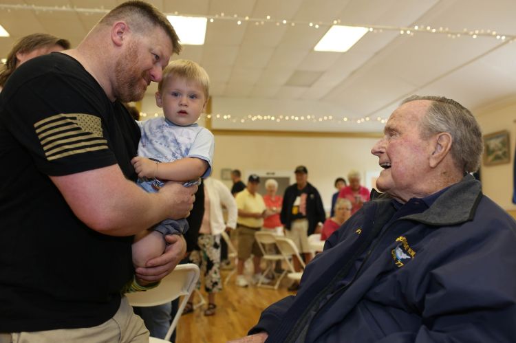 George H.W. Bush greets attendees at the pancake breakfast.