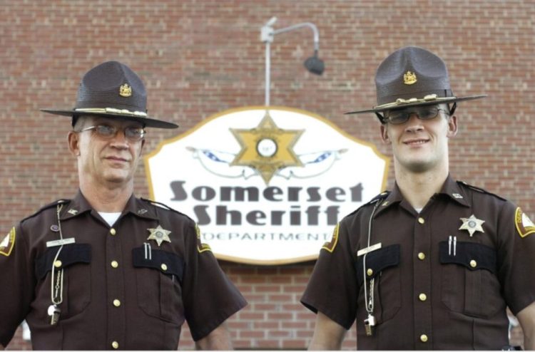 Somerset County Sheriff's Cpl. Eugene Cole, left, and his son, now Detective David Cole, pose in this undated photo.