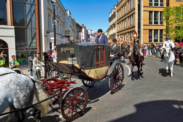 A royal carriage passes through the streets of Windsor, England, during a rehearsal Thursday for the wedding procession of the Prince Harry and Meghan Markle. The wedding is Saturday. 