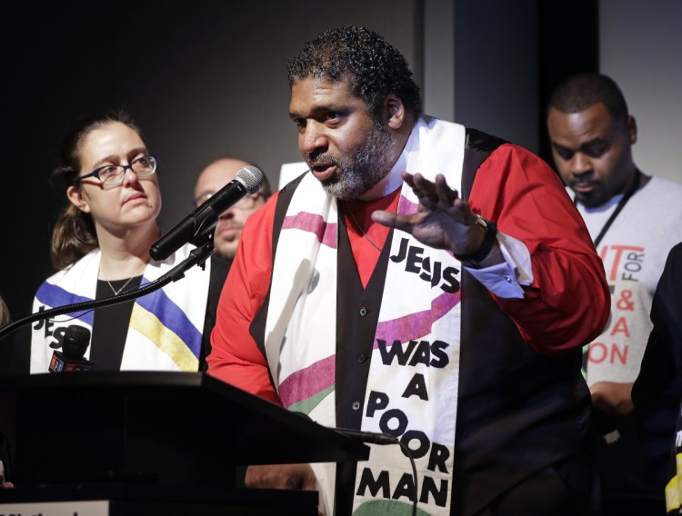 The Rev. Dr. William J. Barber II, center, and the Rev. Dr. Liz Theoharis, co-chairs of the Poor People's Campaign, speak April 3 at the National Civil Rights Museum. Spiritual leaders need to reach the public, a letter writer says.