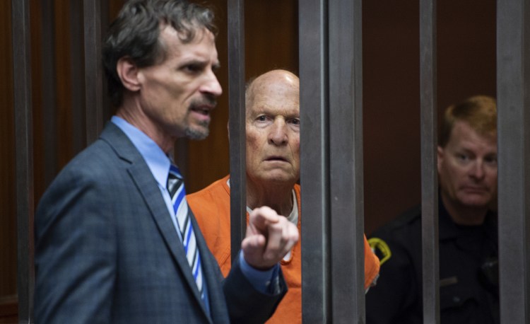 Joseph DeAngelo stands with his attorney Joe Cress in a Sacramento, Calif., jail court on May 29. DeAngelo, dubbed the Golden State Killer, has been charged with the murder of 12 people.