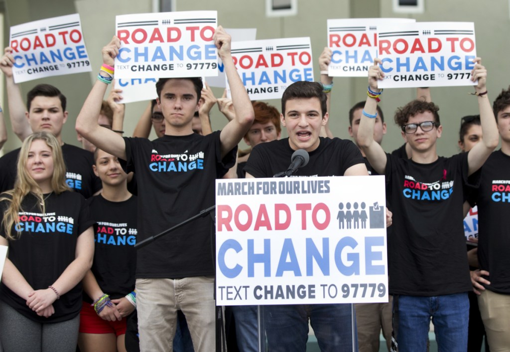 Cameron Kasky, center, said Monday in Parkland, Fla., that the "Road to Change" group will focus on getting the 4 million people turning 18 this year to vote with gun limits in mind.