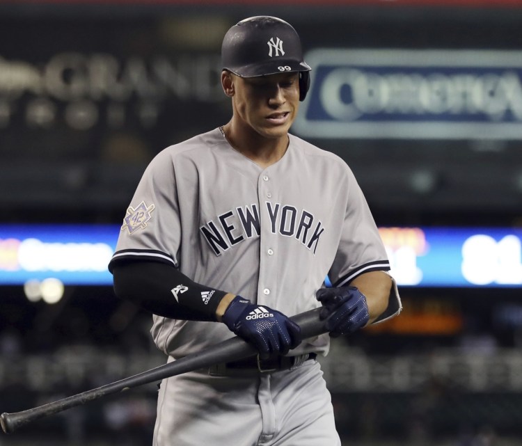 Aaron Judge of the Yankees walks back to the dugout after striking out in the ninth inning for the fifth time in the second game of a doubleheader against Detroit Monday. Judge struck out eight times in the two games,