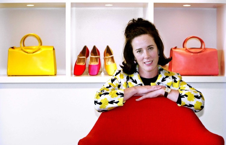 Kate Spade is shown in 2004 with handbags and shoes from her collection.