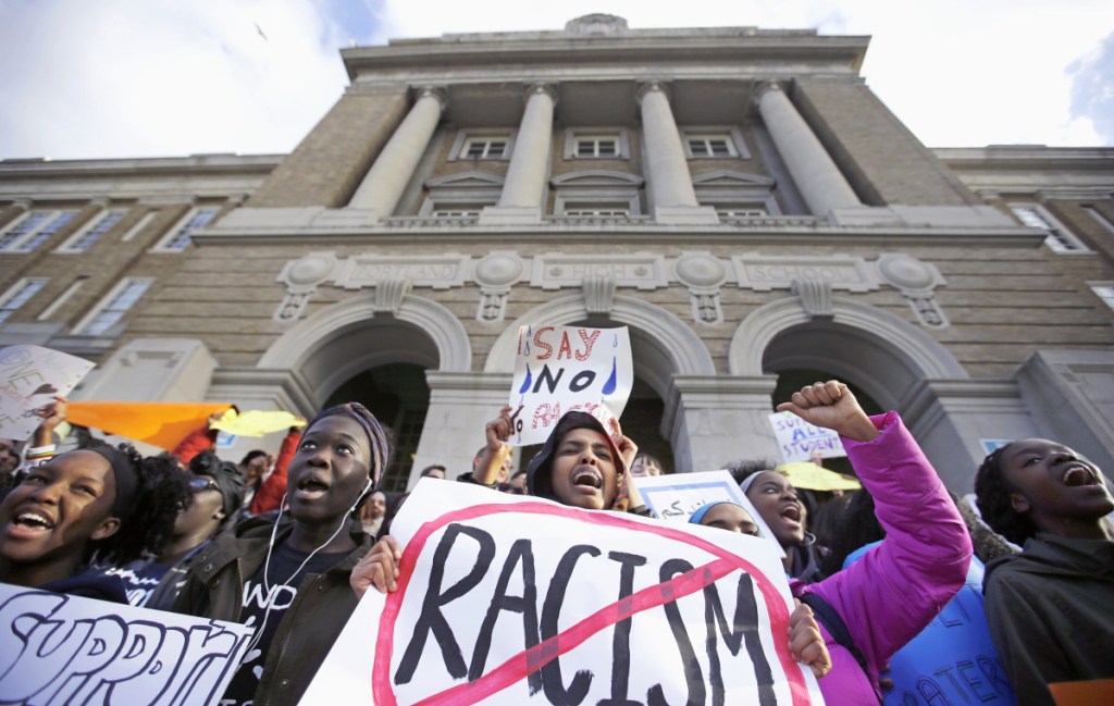 Protesters turn out in February 2017 in response to reports of a hate crime targeting four black Casco Bay High School students. A letter writer questions how hate crimes are defined.