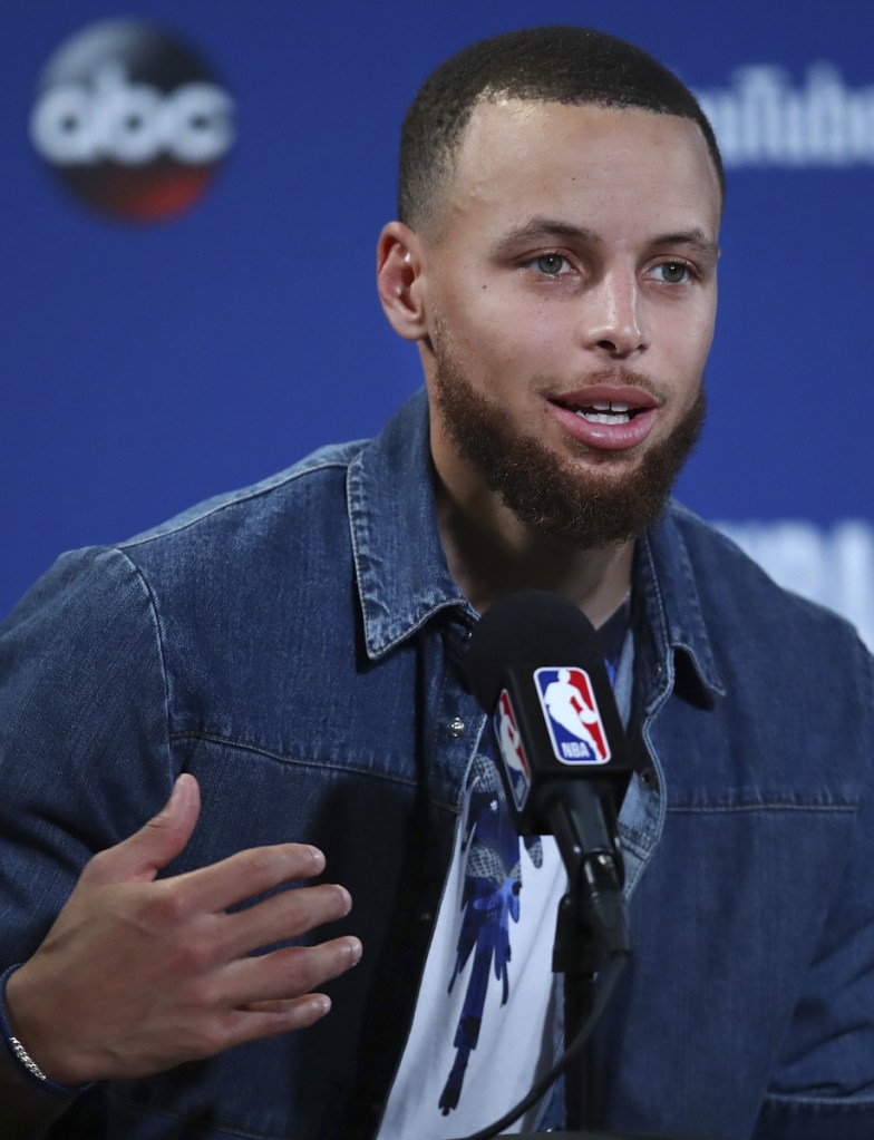 Golden State Warriors guard Stephen Curry speaks at a news conference Sunday in Oakland. On Tuesday, Curry and LeBron James were among those speaking out at the NBA Finals in support of the Philadelphia Eagles, whose scheduled visit to the White House on Tuesday was canceled by President Trump.