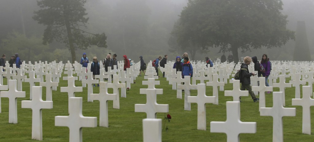 School children visit the American military cemetery in Colleville sur Mer, France, on the 74th anniversary of D-Day.