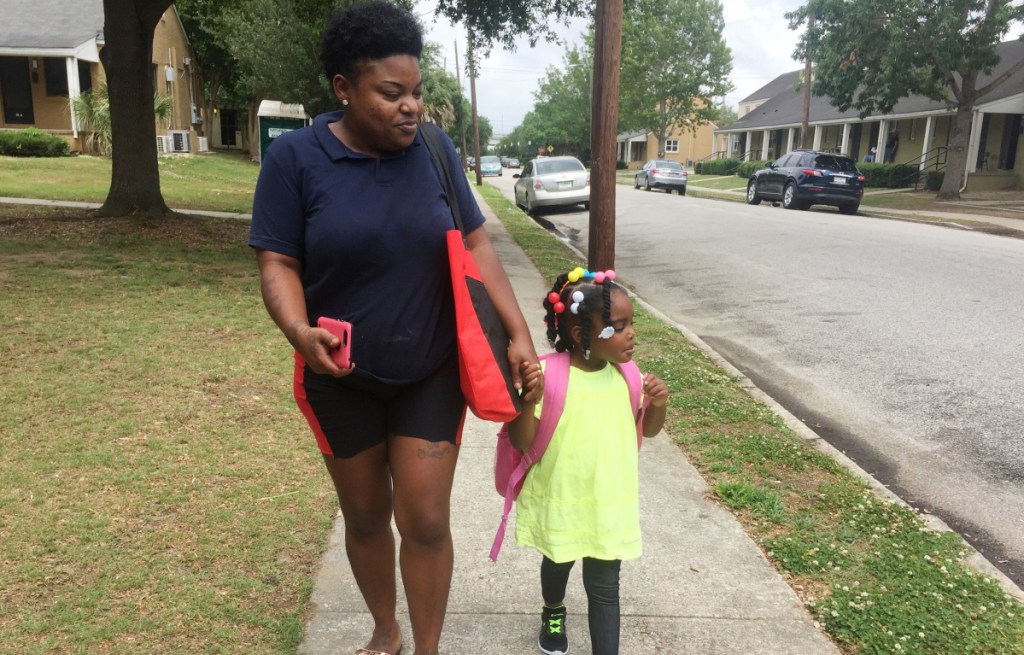 Shannon Brown, 29, with daughter, Sai-Mya, 4, in Charleston, S.C.  Brown lives in public housing and could face a steep rent increase.
Housing and Urban Development Secretary Ben Carson, left, says the rent increase "is our attempt to give poor people a way out of poverty."