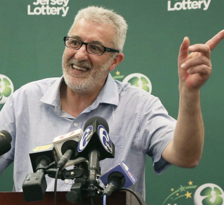 Tayeb Souami of Little Ferry, N.J., is introduced as the $315.3 million winner Friday.