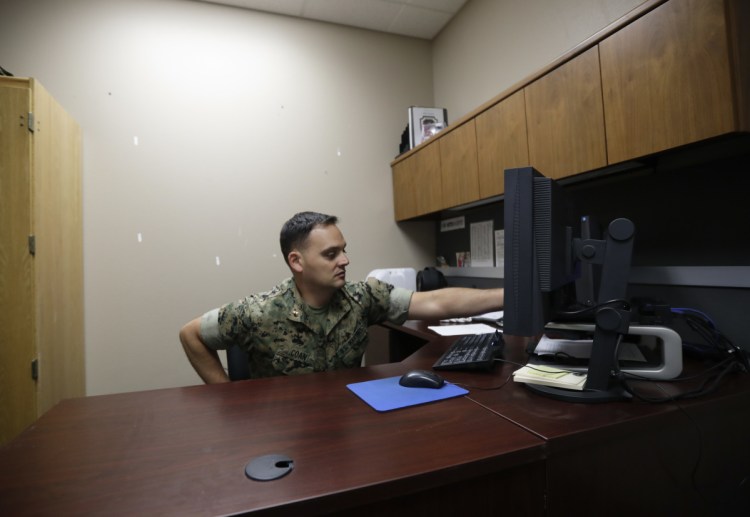 Marine Chief Warrant Officer David Coan, 35, works at his desk in Camp Pendleton, Calif. Coan has applied to be a part of a new cyber force after serving 17 years in the Marines.