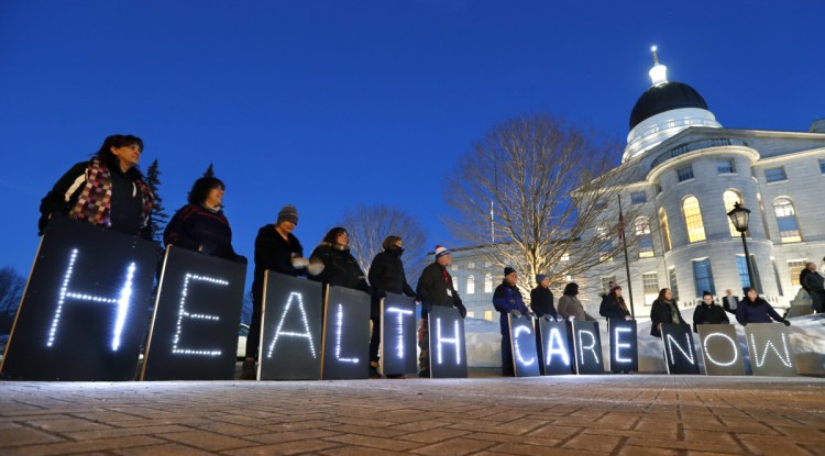 Mainers for Health Care rally outside the State House in Augusta in February.
