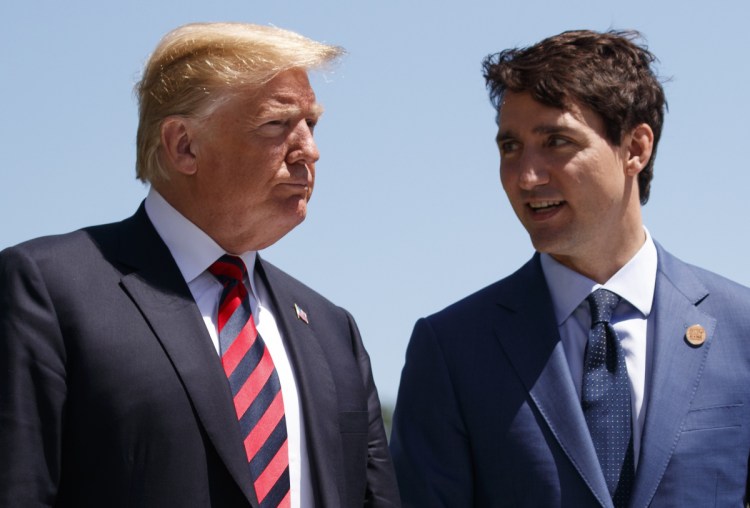 President Trump talks with Canadian Prime Minister Justin Trudeau during a G-7 summit welcome ceremony Friday in Charlevoix, Canada. Trump turned on Trudeau on Sunday.