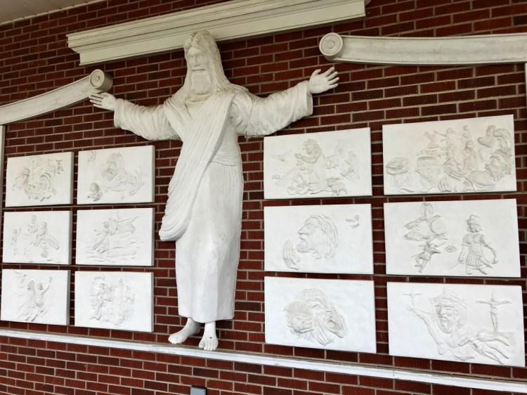 A statue of Jesus and reliefs are seen at Red Bank Baptist Church in Lexington, S.C., 20 miles west of Columbia.