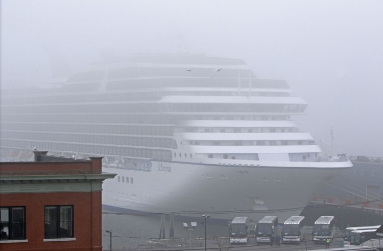 The cruise ship Marina is enshrouded in fog during an April stop in Portland with 1,171 passengers and 800 crew members. Although a 2009 study overestimated passenger spending in Portland, the cruise industry really does bring net economic benefits to the city.