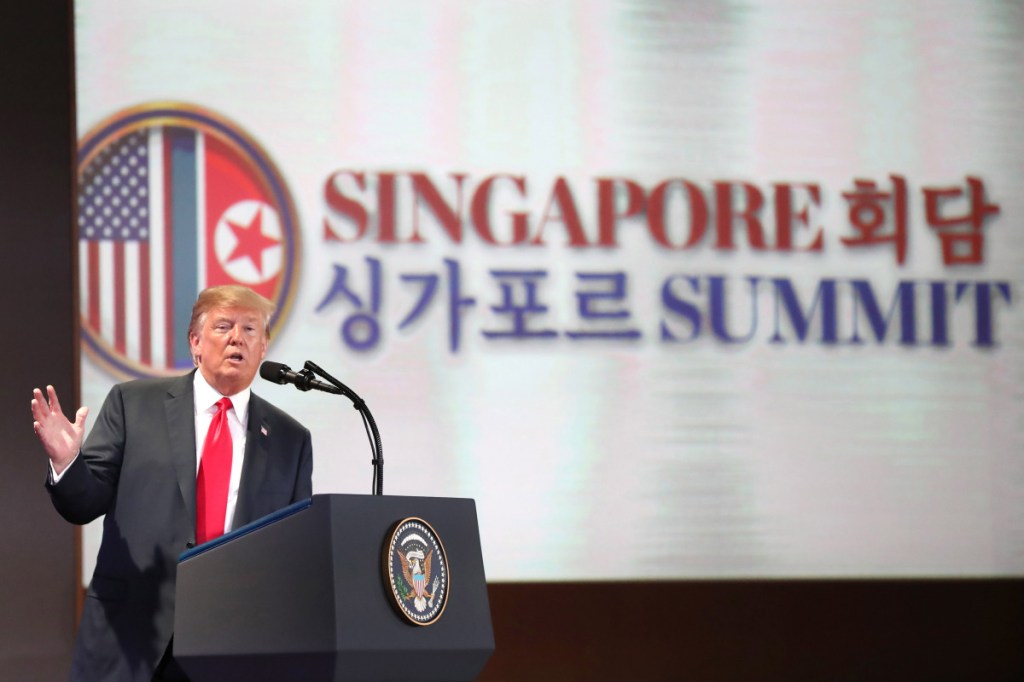President Trump speaks during a news conference in Singapore on Tuesday. He later tweeted that the "deal" he struck with North Korean leader Kim Jong Un meant there was "no longer a Nuclear Threat from North Korea," and "everybody can now feel much safer."