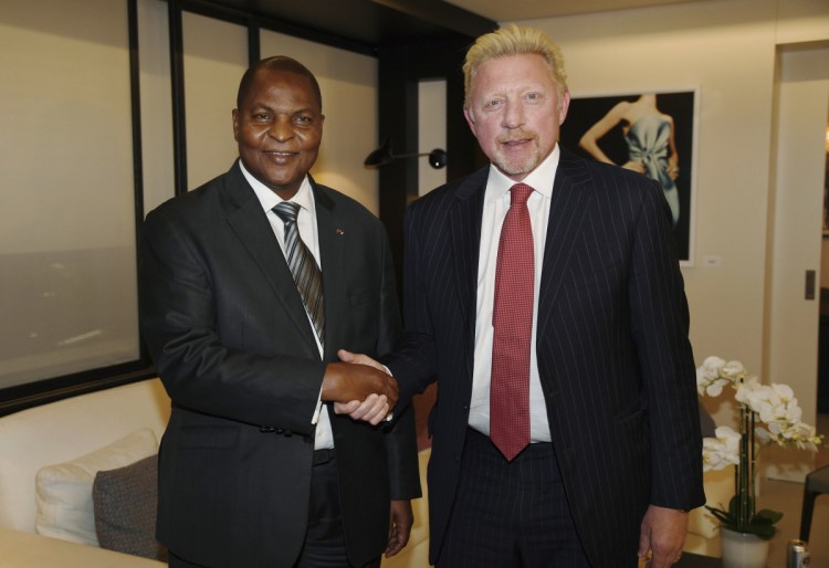  President Prof. Faustin Archange Touadera, left, shakes hands with Boris Becker  in April after it was announced Becker has been appointed by the Central African Republic as its Attache for Sports and Humanitarian and Cultural Affairs in the European Union. 