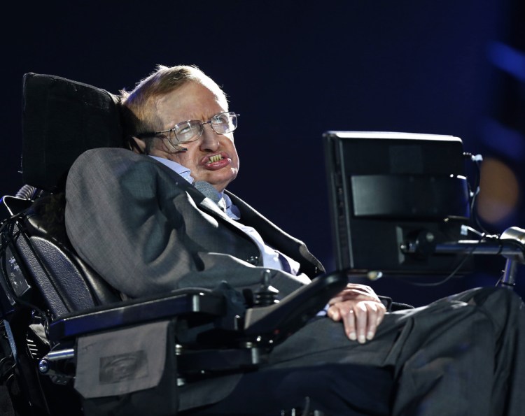 British physicist Stephen Hawking's ashes were buried Friday between the graves of Charles Darwin and Isaac Newton.