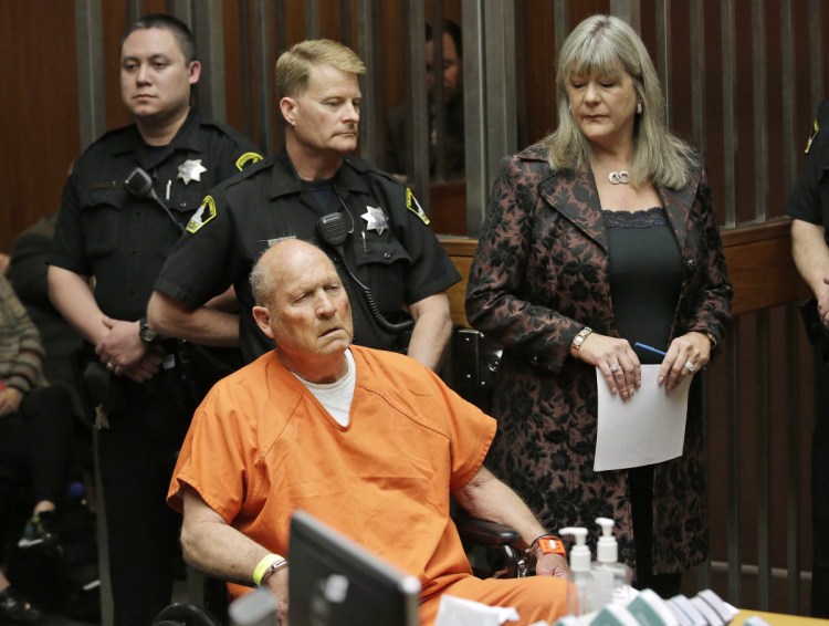 Joseph DeAngelo, 72, who authorities suspect is the so-called Golden State Killer responsible for at least a dozen murders and about 50 rapes in the 1970s and '80s, is accompanied by Sacramento County Public Defender Diane Howard, right.
