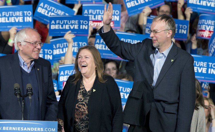 Democratic presidential candidate Sen. Bernie Sanders, I-Vt., his wife, Jane Sanders, and his son Levi Sanders arrive at a primary night rally in Essex Junction, Vt., in 2016. Levi Sanders is one of 11 candidates seeking a N.H. congressional seat.