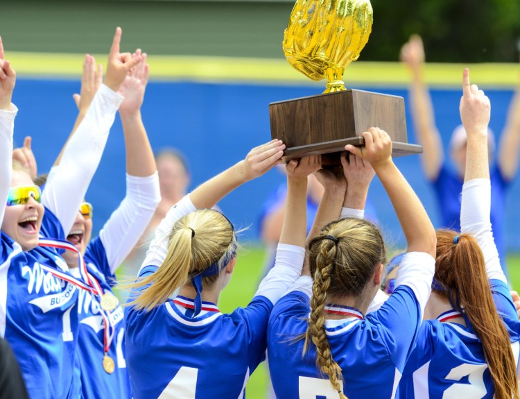The Madison softball team celebrates after it defeated Narraguagus 7-3 in the Class C state title game Saturday at Bailey Field on the St. Joseph's College campus.