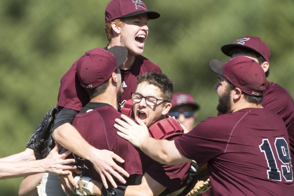 Members of the Richmond baseball team celebrate after Zach Small tossed a no-hitter in an 11-0 victory over Fort Fairfield in the Class D state championship game Saturday at Mansfield Stadium in Bangor.