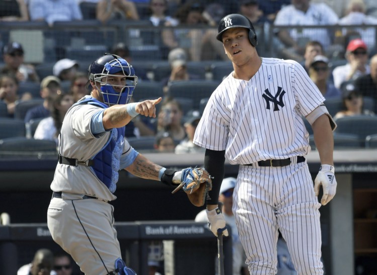 Aaron Judge of the Yankees, right, reacts as Rays catcher Wilson Ramos, left, appeals to the first base umpire on a checked swing. Judge was called out.