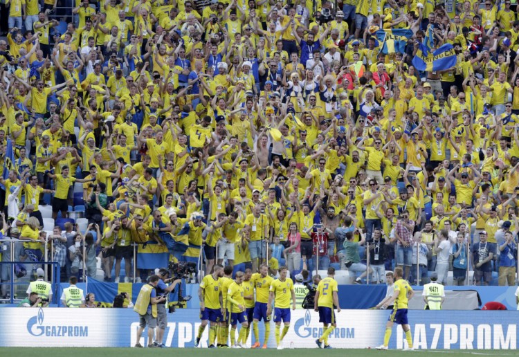 Sweden's Andreas Granqvist, center, celebrates with his teammates after converting a penalty kick in the 65th minute on Monday. Sweden held on to defeat South Korea, 1-0.