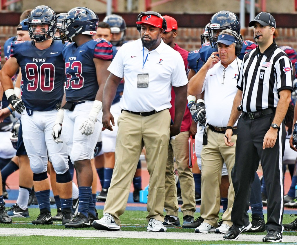Malik Hall, center, spent three seasons as the defensive line coach at the University of Pennsylvania before being hired as the 20th head football coach in Bates College's history on Monday. (University of Pennsylvania)