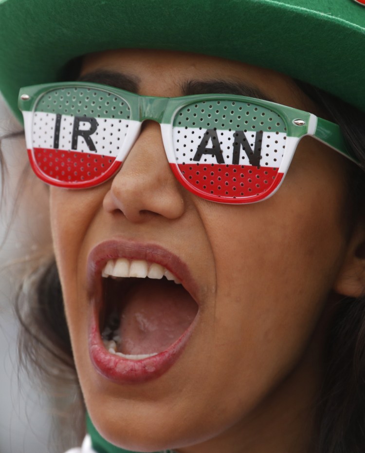 An Iranian fan cheers on her team during its opening World Cup match Friday against Morocco.