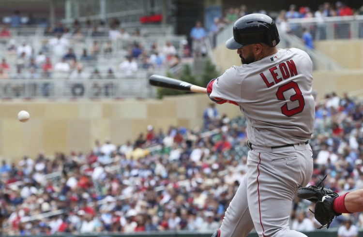 Boston's Sandy Leon gets a hit in the fourth inning Thursday's 9-2 win over the Twins in Minneapolis.