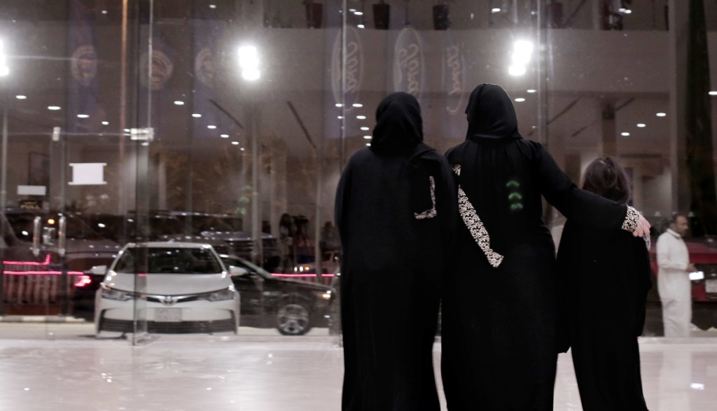 Women leave after looking at cars at the Al-Jazirah Ford showroom in Riyadh, Saudi Arabia, on Thursday.