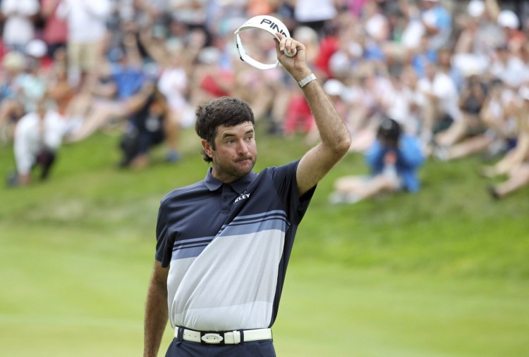 Bubba Watson tips his visor Sunday after making a birdie putt on the 18th green – a fit ending to his third overall victory in the Travelers Championship.