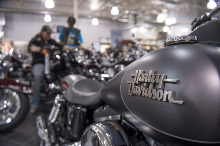 The Harley-Davidson logo is seen on the fuel tank of a motorcycle on display at the Oakland Harley-Davidson dealership in Oakland, Calif.