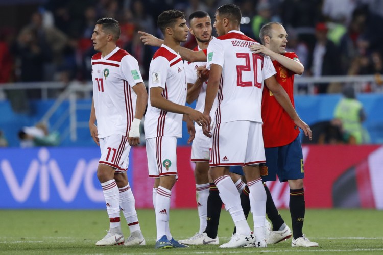 Spain's Andres Iniesta, right, hugs Morocco's Aziz Bouhaddouz after the Group B match between Spain and Morocco at the World Cup Monday at the Kaliningrad Stadium in Kaliningrad, Russia. The game ended in a 2-2 draw.