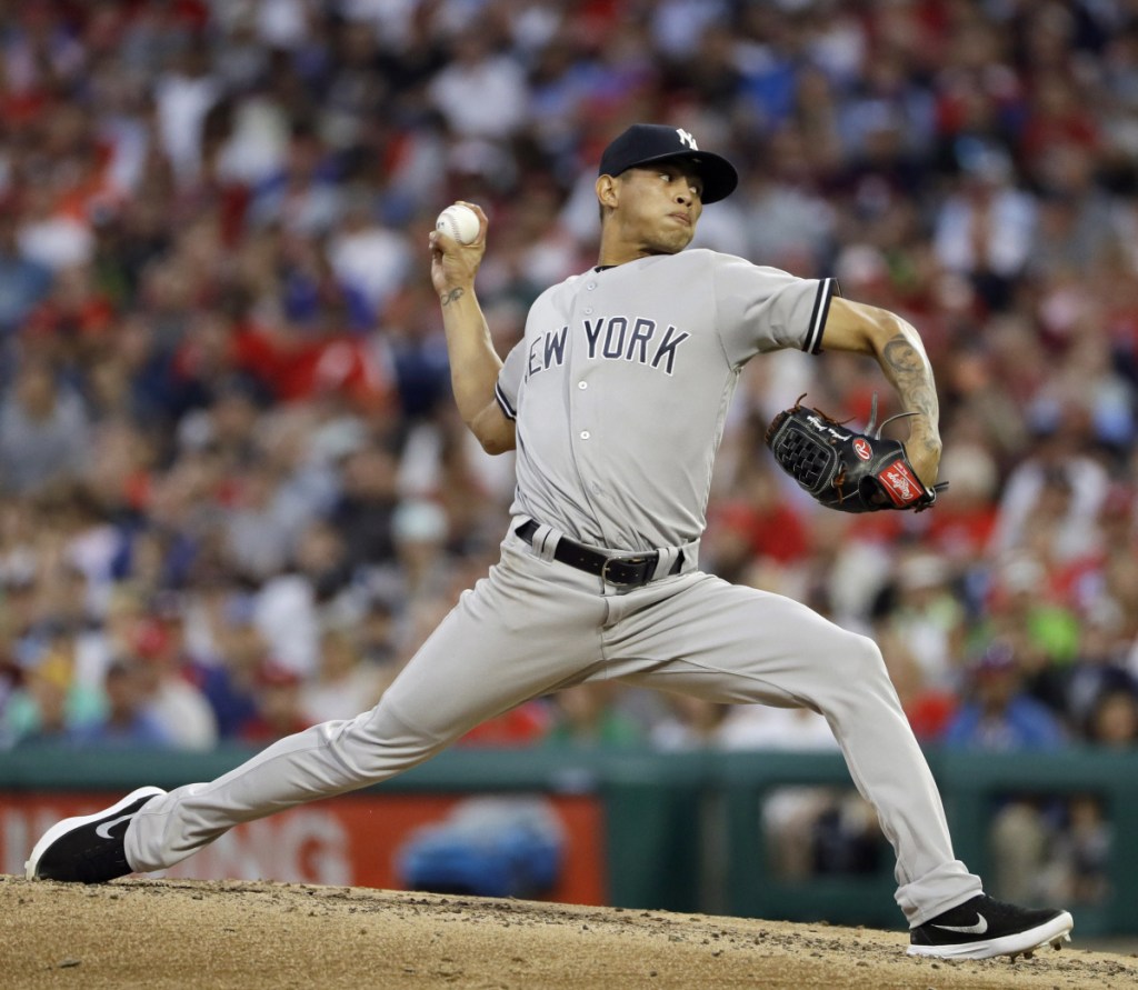 New York's Jonathan Loaisiga delivers a pitch in the fourth inning Monday night against the Phillies in Philadelphia. Loaisiga allowed one hit, struck out eight and walked two in 5  innings and the Yankees won 4-2.
