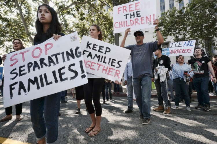 Protesters in Los Angeles voice their opposition to government actions on the Mexican border that punish asylum-seeking families to deter migration.